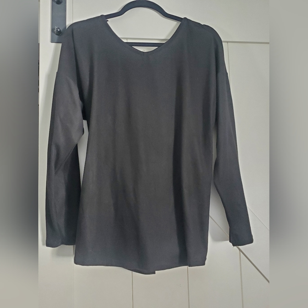 Never worn, Black criss-cross back, long sleeved shirt